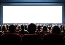 Audience watching a movie in a theater