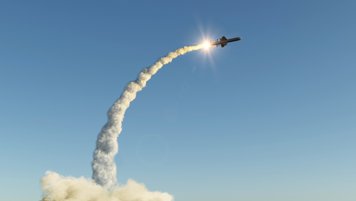 Missile launching into the sky with smoke trail.