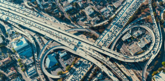 Aerial view of busy multi-level highway interchange.