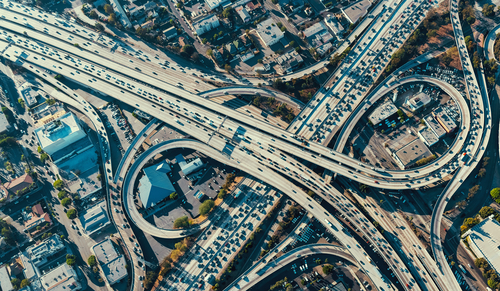 Aerial view of busy multi-level highway interchange.