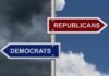 Street signs pointing to Democrats and Republicans direction.