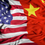 United States and Chinese flags side by side.