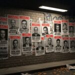 CLASSIFIED Scientists VANISHING — Trump Launches Investigation… Wall covered with missing persons posters in an urban setting