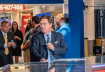 Tucker Carlson’s Holocaust Museum Remarks SPARK FURY… Man in suit speaking at a television studio.