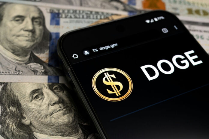 Smartphone displaying DOGE app over dollar bills
