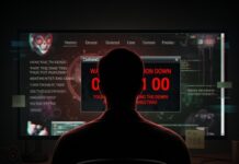 HAPPENING NOW: What Is Q-Day Armageddon? A person sitting in front of a computer screen displaying warning messages and code
