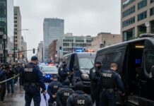 Police officers conducting an operation in an urban area with a crowd present