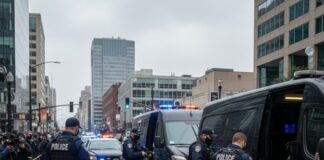 Police officers conducting an operation in an urban area with a crowd present