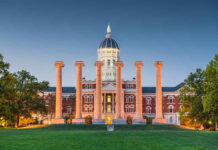 Abuse Allegations Rock Elite Program Historic building with columns at sunset, front view.