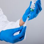 Ozempic Twist: Breast Cancer Link Stuns A healthcare professional preparing a syringe with a vaccine