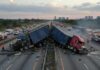 Undocumented Trucker, Three Dead — Tiny Sentence Two overturned trucks blocking a highway with emergency responders at the scene