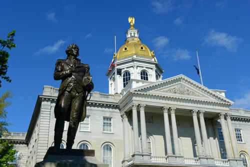 shutterstock_316622594 New Hampshire State House with statue in foreground.